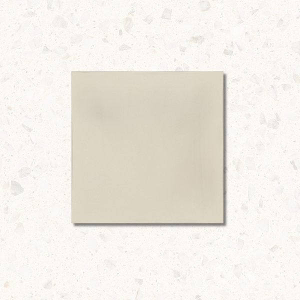 Beige square tile on a light gray textured background